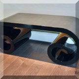 F29. Curved laquer bench 18”h x 45”w  x 18”d 
